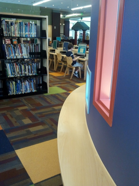 Franklin Avenue Library Children's Section Reading Area: Kids are reading on the floor and in chairs, but not using this bench